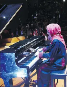  ?? THE ASSOCIATED PRESS ?? Yara Thabit performs during a concert to mark the debut of Gaza’s only grand piano after it was saved from conflict.