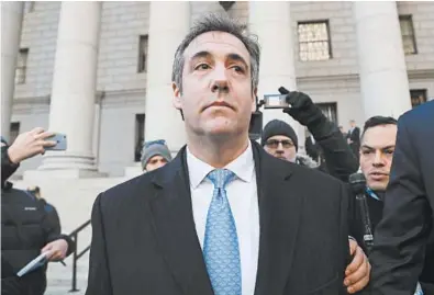  ?? JULIE JACOBSON/AP ?? Michael Cohen walks out of federal court on Thursday after pleading guilty to lying to Congress.