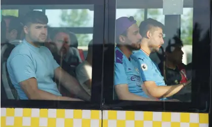  ?? Photograph: James Manning/PA ?? Manchester City fans on a shuttle bus to the Ataturk Olympic Stadium. Some reported they did not return to their accommodat­ion until past 3am.
