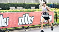  ??  ?? Proud father: Chris Thompson, whose first child was born this week, won the Olympic marathon trials wearing Nike shoes painted black, as he is sponsored by a rival brand