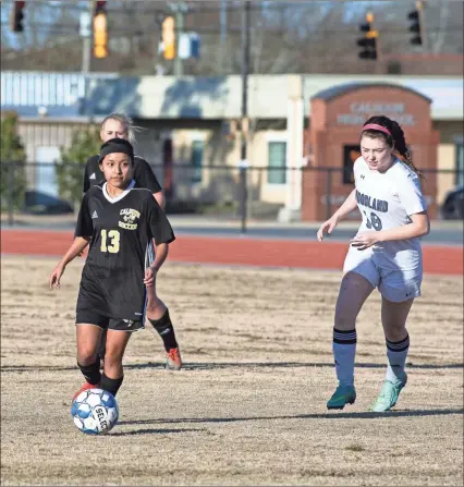  ?? / Tim Godbee ?? Calhoun soccer player Mari Morales looks to deliver a pass downfield against Woodland on Wednesday. The Lady Jackets won 4- 0.