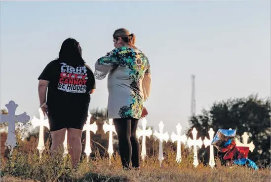  ?? Larry W. Smith EPA/Shuttersto­ck ?? TWENTY-SIX CROSSES stand in Sutherland Springs, Texas, in memory of those killed Sunday. The dead ranged in age from 18 months to 77 years, authoritie­s said.