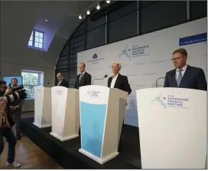  ?? (AP/Peter Dejong) ?? Christine Lagarde, behind the blue lectern, explains the Governing Council’s monetary policy decisions during a news conference Thursday in Amsterdam.