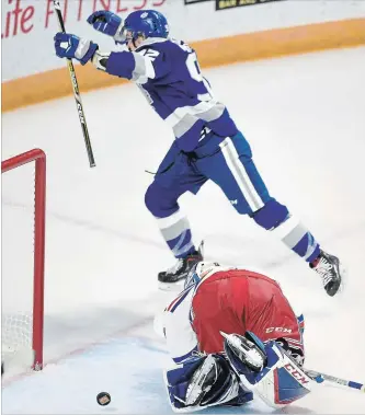  ?? DAVID BEBEE WATERLOO REGION RECORD ?? Sudbury Wolves forward Blake Murray celebrates his winning goal in overtime past Kitchener Rangers goalie Lucas Pfeil on Saturday at the Aud. Pfeil made 34 saves in the tightly contested loss.