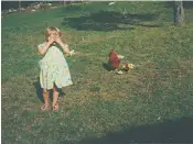  ?? ?? Under their wing: Milka and her grandmothe­r’s chickens