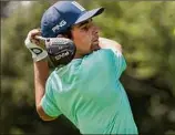  ?? Gregory Shamus / Getty Images ?? Joaquin Niemann of Chile shot a 69 on Friday to gain a share of the lead at the Rocket Mortgage Classic in Detroit.