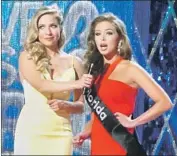  ?? Wayne Parry Associated Press ?? MISS America 2015 Kira Kazantsev, left, interviews Miss Florida Taylor Tyson in a preliminar­y round.