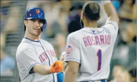  ??  ?? BASH BROS: Pete Alonso celebrates his 48th home run of the season with Amed Rosario in the sixth, who also hit a homer in the Mets’ 6-1 win.