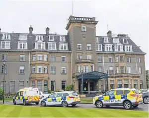  ?? Pictures: Steven Brown and PA. ?? Police at the Gleneagles Hotel on the day of the jewellery heist. Below: CCTV of a man police want to question.