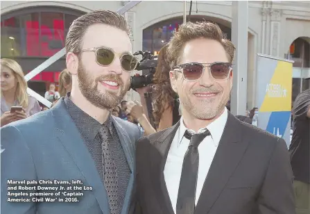  ?? AP FILE PHOTO ?? Marvel pals Chris Evans, left, and Robert Downey Jr. at the Los Angeles premiere of ‘Captain America: Civil War’ in 2016.