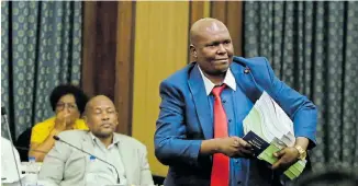  ??  ?? DONE AND DUSTED: Mongameli Bobani leaves the council chamber after the DA, ANC, AIC, ACDP, COPE and Patriotic Alliance voted to remove him as mayor