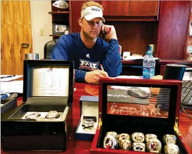  ?? HAL HABIB / THE PALM BEACH POST ?? Owls coach Lane Kiffin sits in his office, home to the championsh­ip rings he has won during his coaching career at Southern Cal, Alabama and FAU.