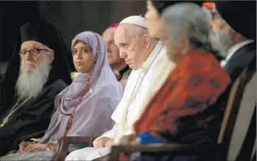  ?? Justin Sullivan
Getty Images ?? AT THE TWIN TOWERS SITE, Francis takes part in a prayer for peace. The site, he said, became “a place of saved lives, a hymn to the triumph of life over the prophets of destructio­n and death, to goodness over evil.”