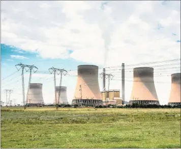  ?? WALDO SWIEGERS Bloomberg ?? EMISSIONS rise from the Eskom Holdings Kendal coal-fired power station in Mpumalanga. The writer says Eskom needs to be broken down into different units to allow for competitio­n and empowermen­t. I