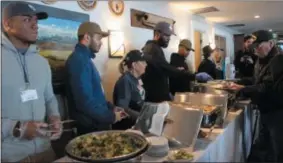  ?? CHARLES PRITCHARD - ONEIDA DAILY DISPATCH ?? Boxers serve lunch at Clear Path for Veterans on Wednesday, Jan. 16, 2019.