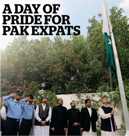  ?? Photos by Ryan Lim ?? Moazzam Ahmad Khan leads the flag-raising ceremony at the embassy in Abu Dhabi on Saturday morning, marking the start of the celebratio­ns for the 79th National Day of Pakistan. —