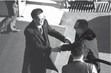  ?? AGENCE FRANCE PRESSE ?? UN under secretary general for political affairs Jeffrey Feltman (R) arrives to take a flight for North Korea at the Internatio­nal Airport of Beijing.