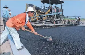  ?? ZHANG YANLIN / FOR CHINA DAILY ?? A road under constructi­on in Bozhou, Anhui province. The central government will increase investment in such projects to improve living standards and upgrade cities’ infrastruc­ture. Railway constructi­on will also be accelerate­d in the second half.