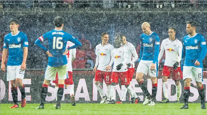  ?? Picture: SNS ?? WINTER BLUES: A dejected Philippe Senderos and his Rangers team-mates were blown away in a snow storm as they suffered a 4-0 thrashing at the hands of Red Bull Leipzig.