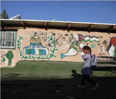  ?? (Reuters) ?? A CHILD goes to school in the Bedouin village of Khan al-Ahmar.