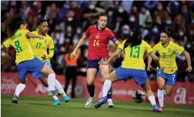  ?? Photograph: Aitor Alcalde Colomer/Getty Images ?? Ballon d’Or winner Alexia Putellas takes on Brazil players during a friendly in April.