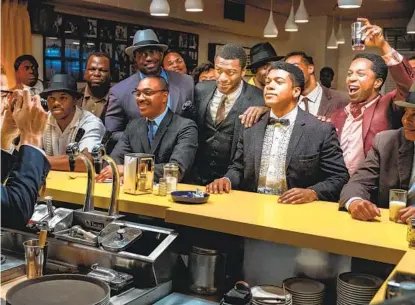  ?? PATTI PERRET AMAZON STUDIOS ?? Aldis Hodge (center) as Jim Brown, Eli Goree (in bow tie) as Cassius Clay and Leslie Odom Jr. (raising glass) as Sam Cooke.