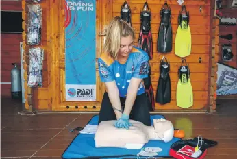  ?? Victor Besa / The National ?? Emergency first response instructor Nicola Liddell demonstrat­es CPR on a dummy. She says everyone needs to know CPR, especially people who work with children