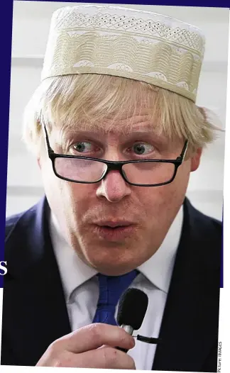  ?? S E G A M iI : e r u t c i P ?? Lo and behold: Boris dons the hat proffered at an Islamic centre
