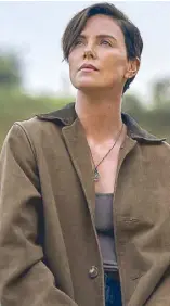  ??  ?? Photo shows Charlize Theron in a scene from ‘The Old Guard.’