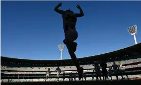  ?? Photograph: Quinn Rooney/Getty Images ?? Nathan Murphy runs out onto the MCG. The Collingwoo­d defender has retired from AFL football on medical advice around concussion­s.