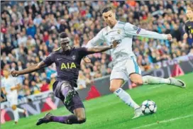  ?? AFP ?? Real’s Cristiano Ronaldo (R) vies with Spurs’ Davinson Sanchez during their Champions League group match at the Santiago Bernabeu on Tuesday.