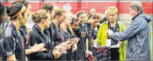  ?? JEFF MILLER/USPORTS ?? Members of the Cape Breton Capers women’s soccer team line up to accept their silver medals after losing 1-0 in the final game of the U Sports national championsh­ip played in Winnipeg, Man., Sunday. Head coach Ness Timmons said while the players were disappoint­ed, they have nothing to be ashamed about and had what he called a ‘super season.’