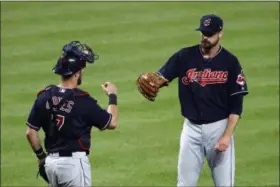  ?? PATRICK SEMANSKY — THE ASSOCIATED PRESS ?? Indians catcher Yan Gomes and relief pitcher Andrew Miller celebrate the team’s win over the Orioles in Baltimore on June 22.