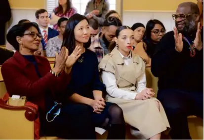  ?? MATTHEW J. LEE/GLOBE STAFF ?? Reparation­s task force members applauded Mayor Michelle Wu during a ceremony introducin­g the task force at the Museum of African American History.