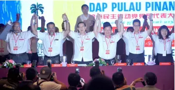  ??  ?? Lim (third left) in group photo with DAP Penang chairman Chow Kon Yeow (third right) and committe members during the Penang DAP convention. — Bernama photo