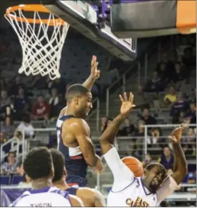  ?? JOE PELLEGRINO - THE DAILY REFLECTOR VIA AP ?? East Carolina’s Caleb White (2) clashes with Connecticu­t’s Rodney Purvis (15) under the net Wednesday, March 1, 2017, in Greenville, N.C.