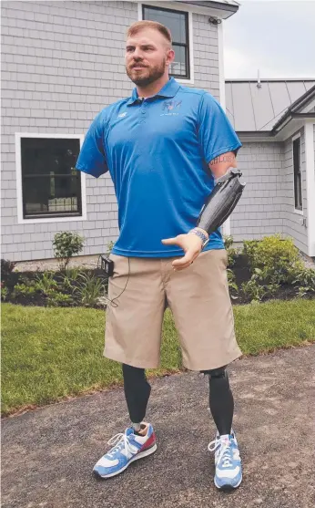  ?? Picture: AP ?? Travis Mills gives a tour of his wounded veterans' camp in Rome, Maine.