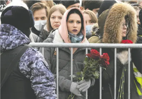  ?? THE ASSOCIATED PRESS ?? People gather in Moscow for the funeral of Alexei Navalny. Navalny, who was Russia’s top opposition leader and President Vladimir Putin’s fiercest foe, was laid to rest two weeks after his still-mysterious death in an Arctic prison.