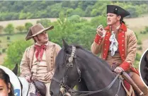  ?? LAURIE SPARHAM, AP ?? Luke Evans (right, with Josh Gad) made a great Gaston; nice try, Idris Elba.