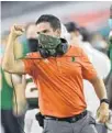  ?? MICHAEL LAUGHLIN/SUN SENTINEL ?? Miami head coach Manny Diaz celebrates a touchdown against Florida State on Sept. 26.