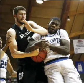  ?? THE ASSOCIATED PRESS FILE ?? Villanova forward Eric Paschall, right, here battling Butler center Nate Fowler for a rebound in a game Feb. 22, says he’s living the dream of being a full-time Wildcats player for this year’s NCAA Tournament run.