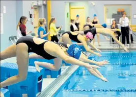  ?? FILE PHOTO / SENTINEL & ENTERPRISE ?? Swim meets like this one last year in the Fitchburg State University pool have had to find a new home in recent months, as the pool has been closed. Community groups are urging the university to repair the facility and the subject is on the FSU board of directors agenda for next week.