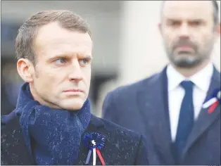  ?? AP PHOTO ?? French President Emmanuel Macron and French Premier Edouard Philippe attend a ceremony Sunday at the Arc de Triomphe in Paris, France, as part of the commemorat­ions marking the 100th anniversar­y of the Nov. 11, 1918, armistice, ending the First World War.