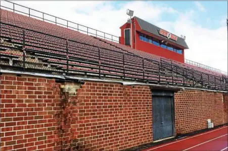  ?? DIGITAL FIRST MEDIA FILE PHOTO ?? A report by Barry Issett & Assoc. on the condition of the high school stadium concluded that “the entire section of wall along the track is unsafe and a potential hazard.”