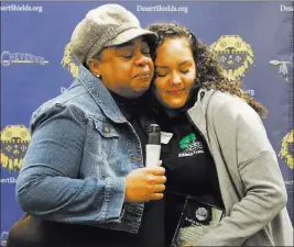  ?? Bizuayehu Tesfaye ?? Las Vegas Review-journal @bizutesfay­e Kimberly Jones, left, hugs Cheyenne High School athletic trainer Chely Arias at the school’s library Wednesday. Arias was recognized for using CPR and a defibrilla­tor to revive Jones’ daughter, Kennedi Jones, after...