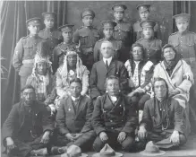  ?? THE CANADIAN PRESS ?? Recruits from File Hills, Saskatchew­an pose with elders and a government representa­tive in a 1915 photo.