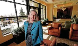  ?? [AP PHOTO] ?? Lisa A. Goodbee, president Goodbee Associates, poses for a photo in the lobby of the building where the civil engineerin­g firm is located in the Denver south suburb of Greenwood Village, Colo.