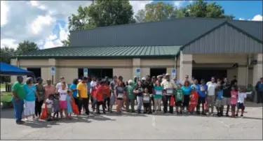  ?? JORDANA JOY — THE MORNING JOURNAL ?? Residents gather Sept. 15 for an annual community block party at South Park Thomas O. Shores South Recreation Center, 101 S. Park Drive in Elyria.