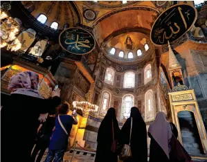  ?? Reuters ?? TOURIST SPOT: People visit the Hagia Sophia or Ayasofya, a Unesco World Heritage Site in Istanbul, on Friday. —