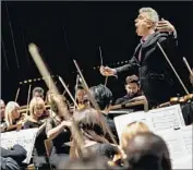  ?? Marcus Yam Los Angeles Times ?? DAVID LOCKINGTON directs Pasadena Symphony, which is seeking a new contract with a pay increase.